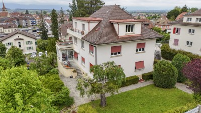Immeuble de rendement avec grand jardin arboré