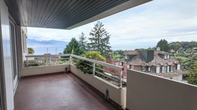 Magnifique appartement traversant avec balcon et vue lac